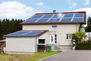 House With Solar Panels On Roof